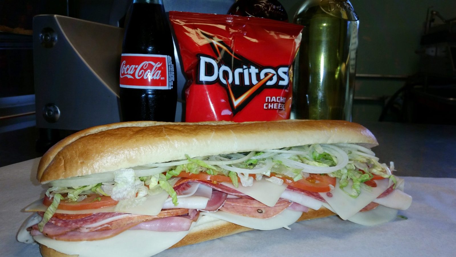 A Tony's sub with chips and a chocolate chip cookie